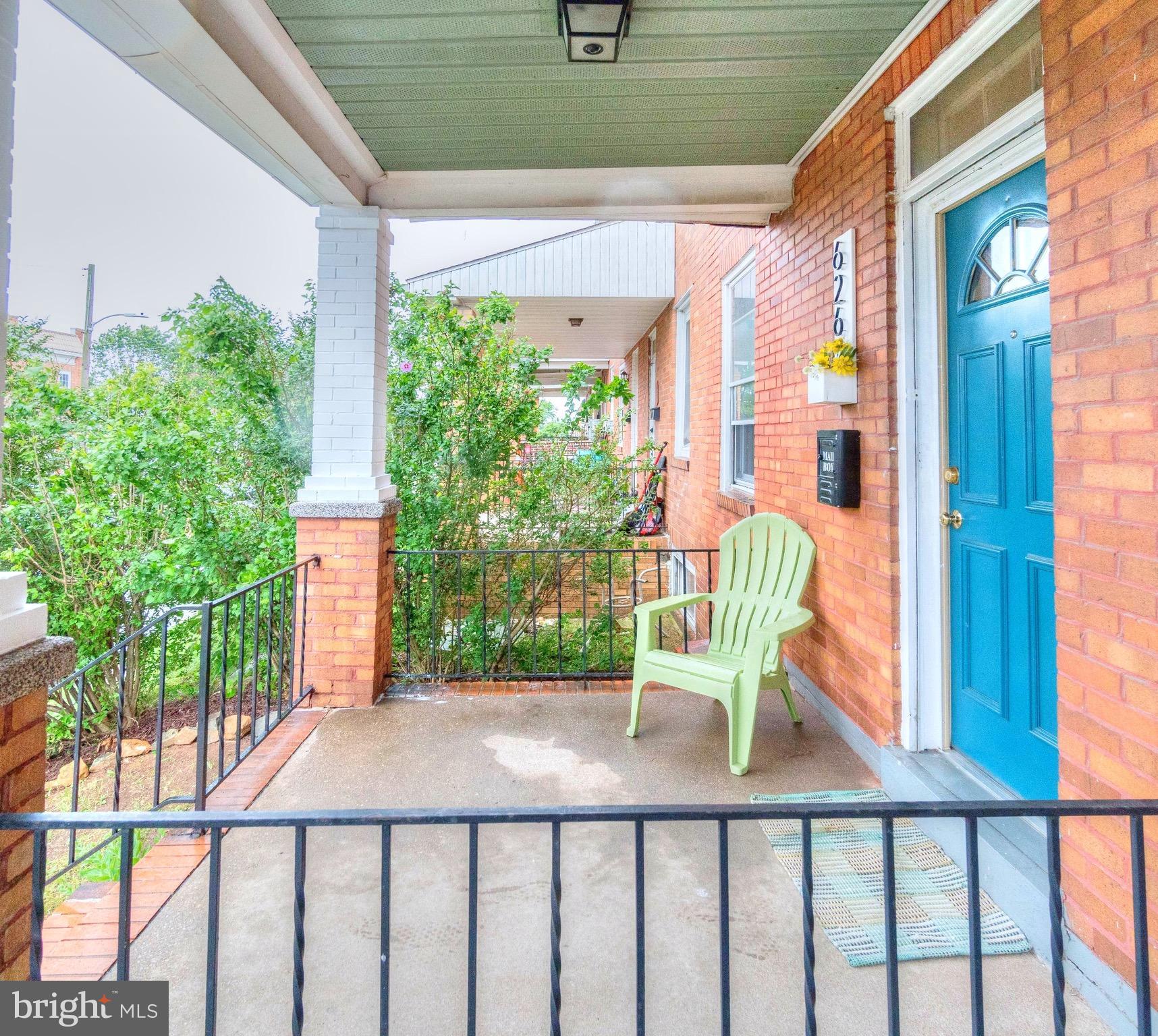 626 Rappolla Street Baltimore, MD 21224 - Photo 3 of 24 a porch with a bench in front of a house