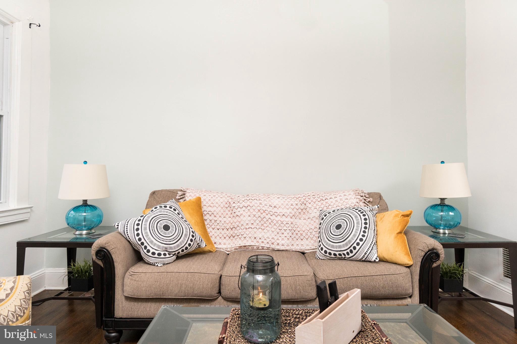 626 Rappolla Street Baltimore, MD 21224 - Photo 5 of 24 a living room with furniture and a table