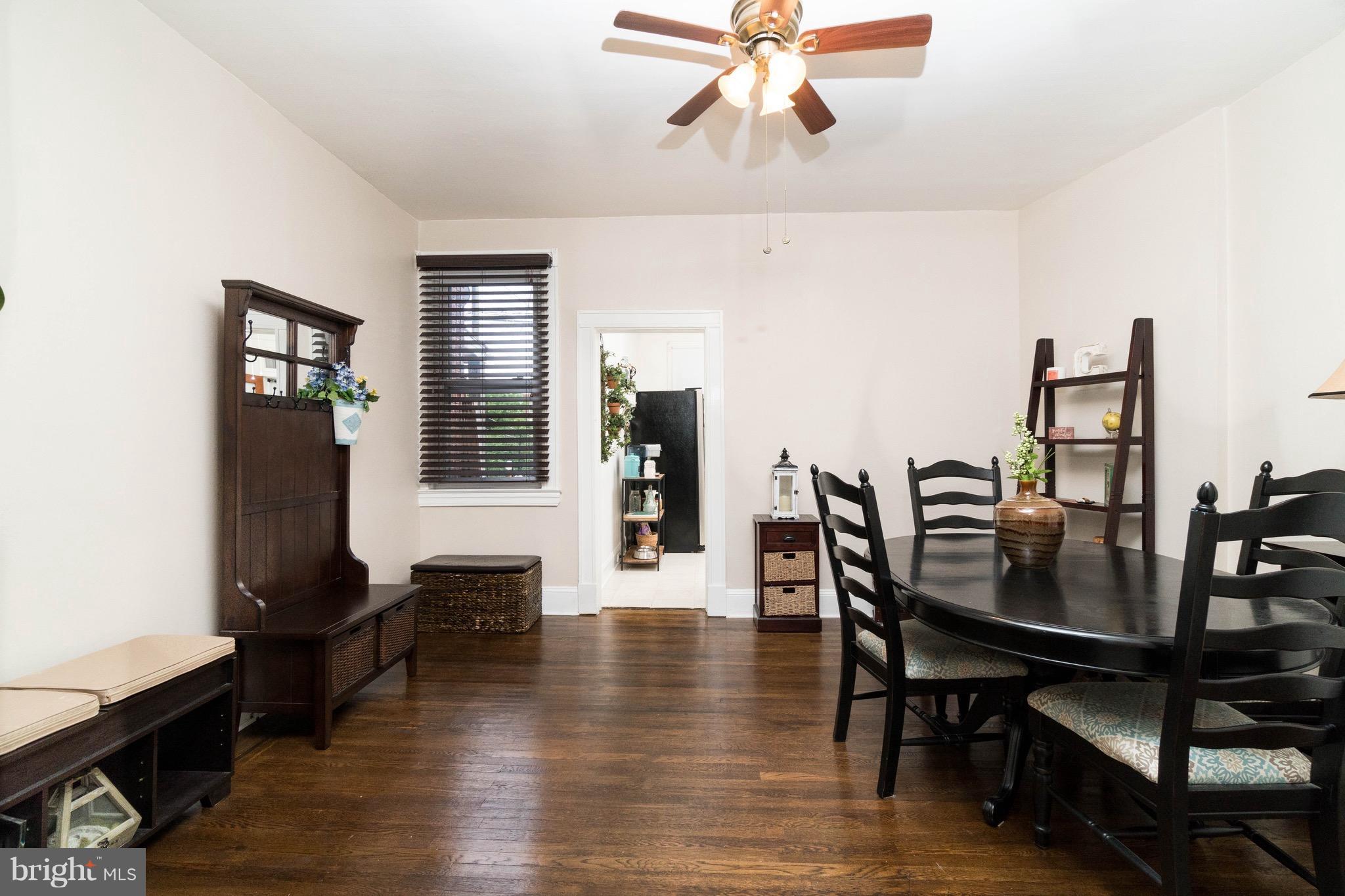 626 Rappolla Street Baltimore, MD 21224 - Photo 7 of 24 a view of a dining room with furniture and wooden floor