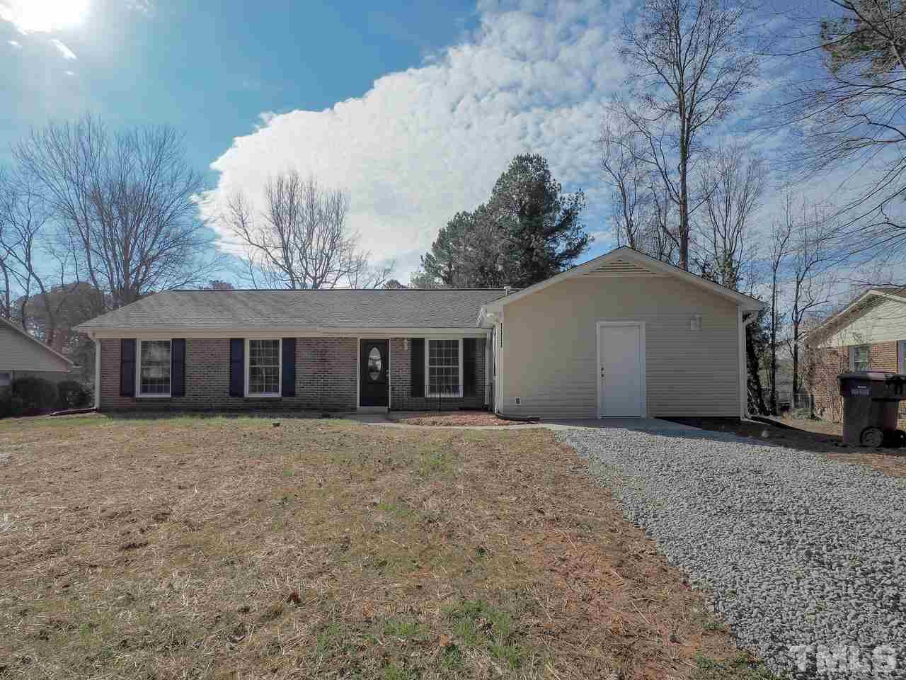 1111 Wyldewood Road Durham, NC 27704 - Photo 1 of 17 a front view of a house with a yard