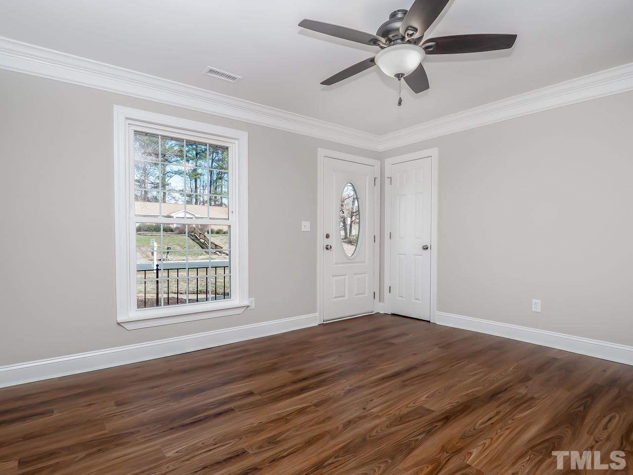 1111 Wyldewood Road Durham, NC 27704 - Photo 14 of 17 wooden floor in an empty room with a window