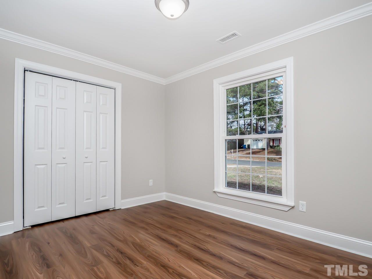 1111 Wyldewood Road Durham, NC 27704 - Photo 5 of 17 a view of wooden floor and windows in a room
