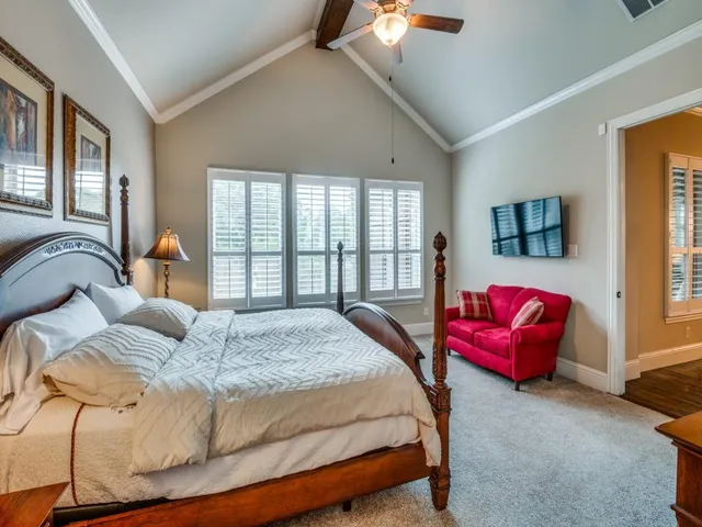 a bedroom with bed and a window