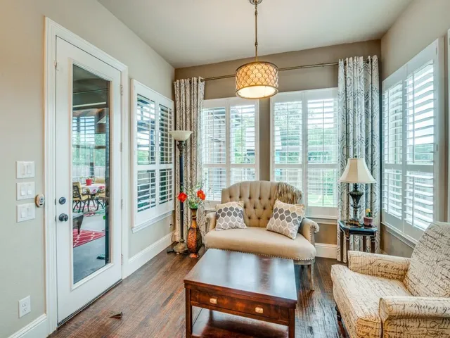 a living room with granite countertop kitchen island furniture and a fireplace