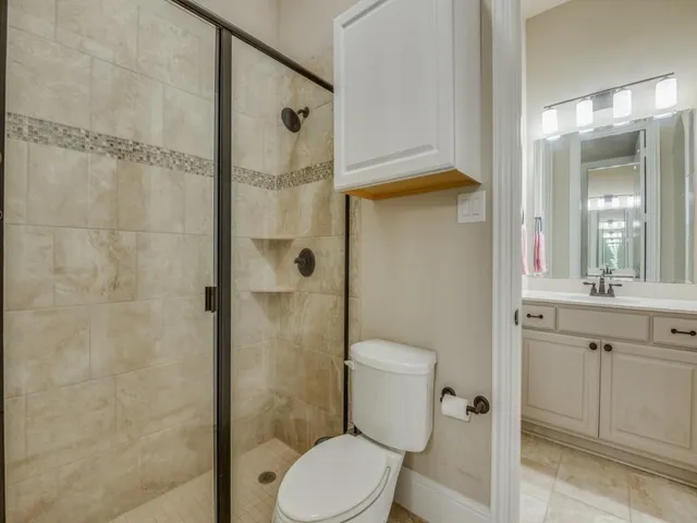 a bath tub sitting next to a bathroom sink