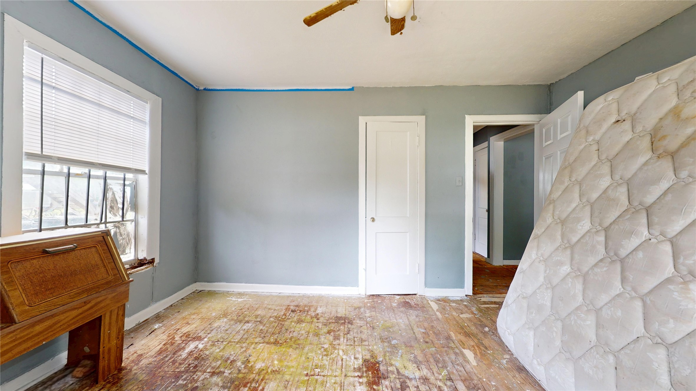 6604 Conley Street Houston, TX 77021 - Photo 18 of 28 a view of a bedroom with a hardwood and hallway