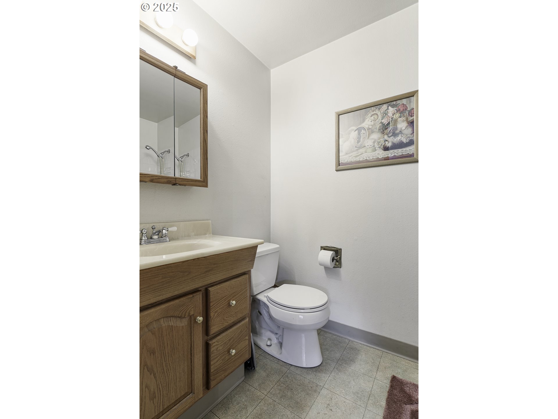 22285 Southeast Ridgeview Drive Damascus, OR 97089 - Photo 19 of 32 a bathroom with a toilet sink and mirror