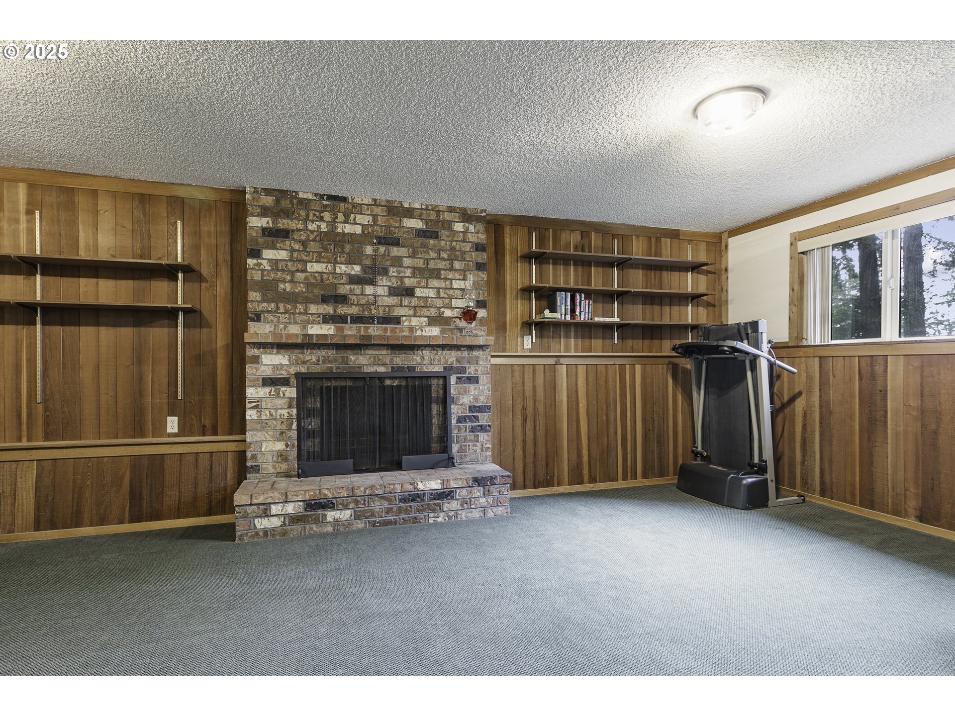 22285 Southeast Ridgeview Drive Damascus, OR 97089 - Photo 20 of 32 a living room with a fireplace furniture and a window