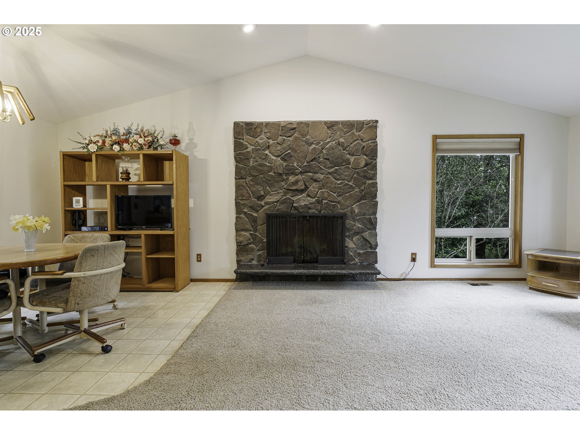 22285 Southeast Ridgeview Drive Damascus, OR 97089 - Photo 8 of 32 a view of a livingroom with furniture and a fireplace