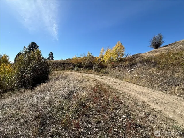 a view of a road with a building in the background