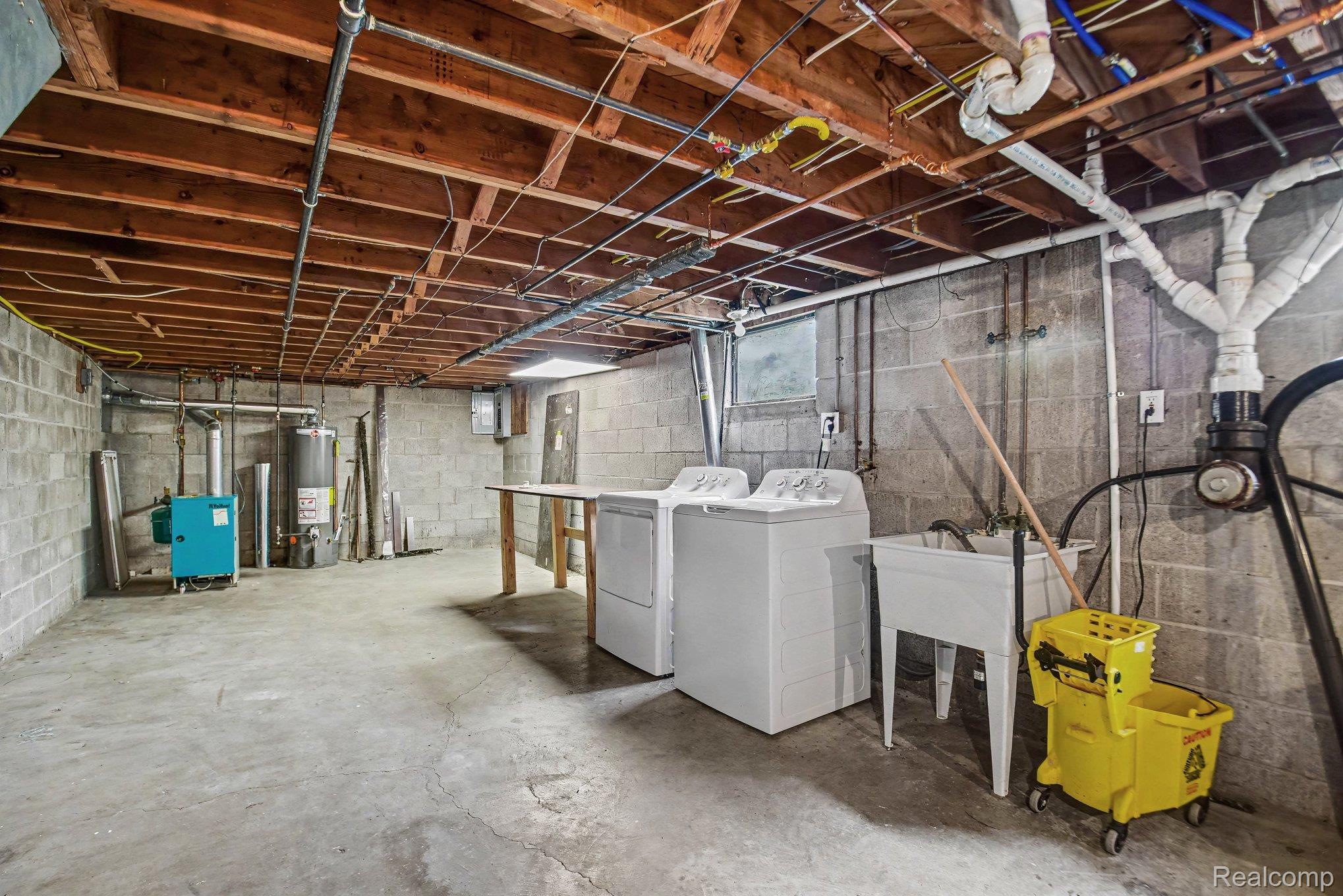 2487 North Lapeer Road Lapeer, MI 48446 - Photo 14 of 16 Concrete block walls with exposed wood joist ceiling