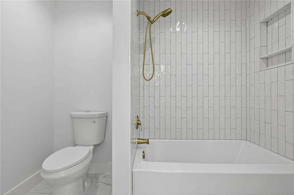 88 Carolyn Path Rockmart, GA 30153 - Photo 36 of 73 a bathroom with a toilet and a bath tub