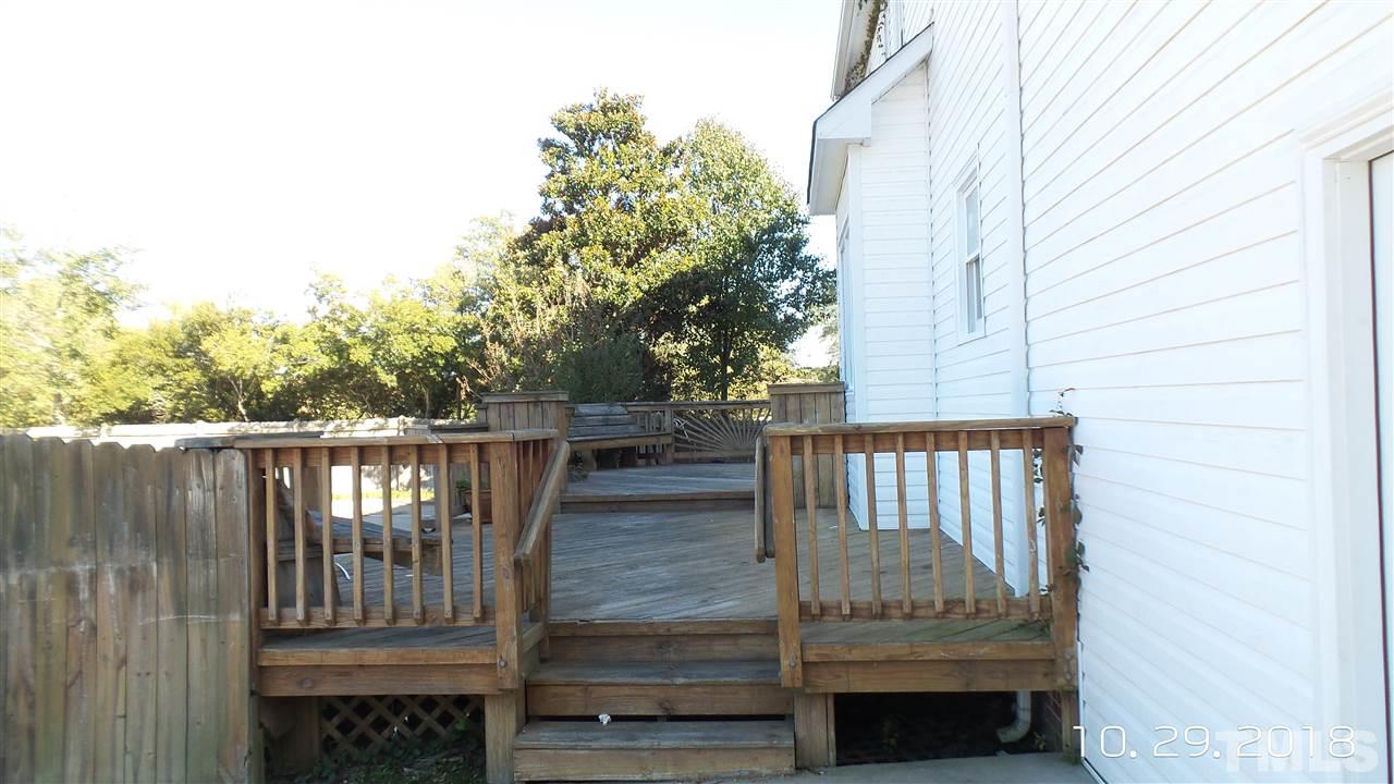 10305 Ten-Ten Road Raleigh, NC 27603 - Photo 5 of 17 a view of balcony with wooden floor and fence