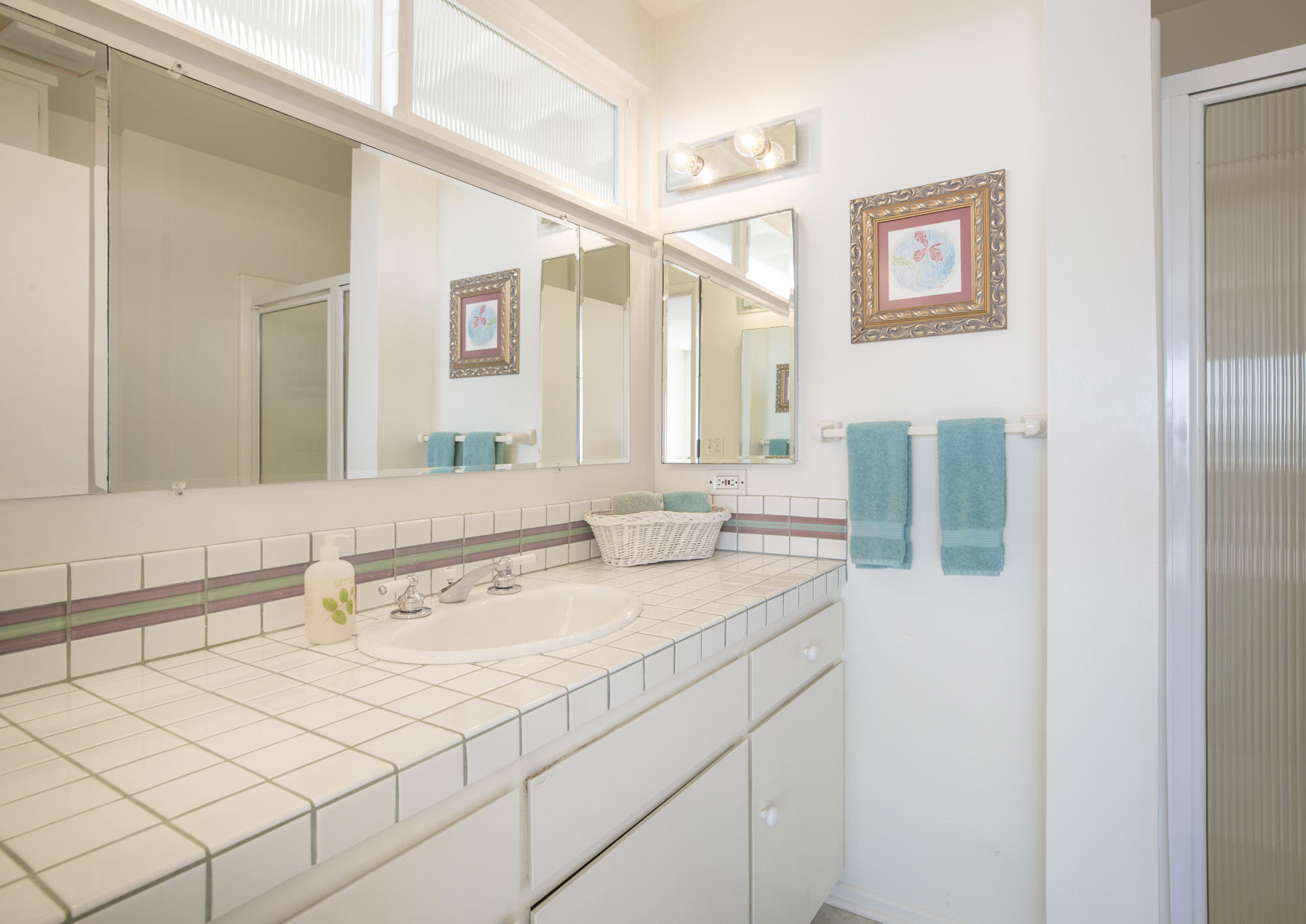 3108 Solimar Beach Drive Ventura, CA 93001 - Photo 12 of 22 a bathroom with a sink and a mirror