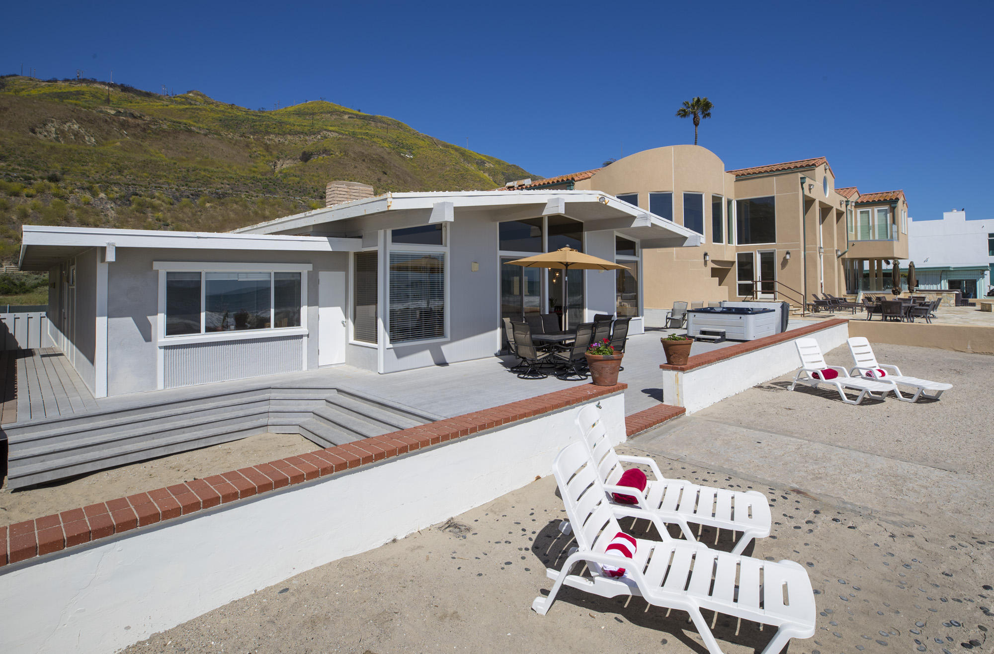 3108 Solimar Beach Drive Ventura, CA 93001 - Photo 2 of 22 a front view of a house with outdoor seating