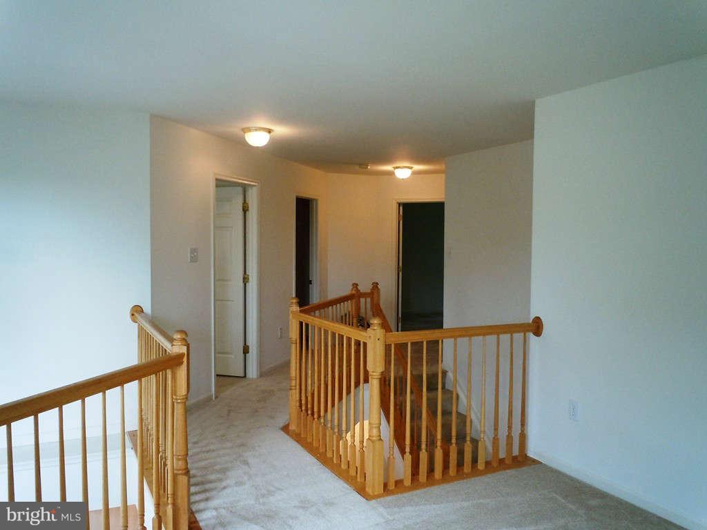 13315 Copper Ridge Road Germantown, MD 20874 - Photo 21 of 29 From the Loft over catwalk to upper level landing