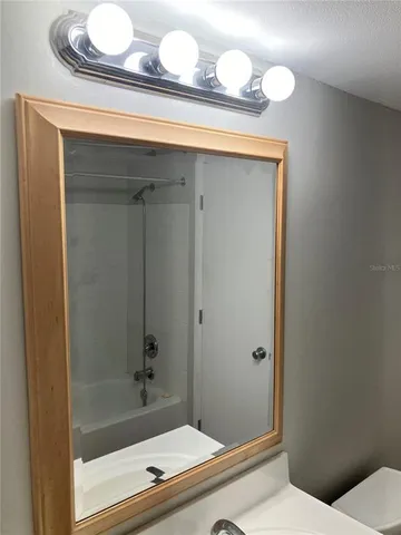 a backyard of a house with lots of green space and plants