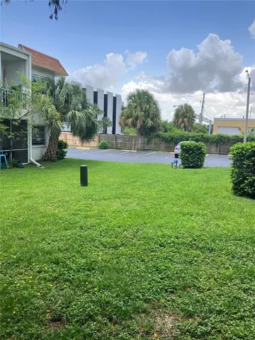 a kitchen with stainless steel appliances granite countertop a stove a sink and white cabinets