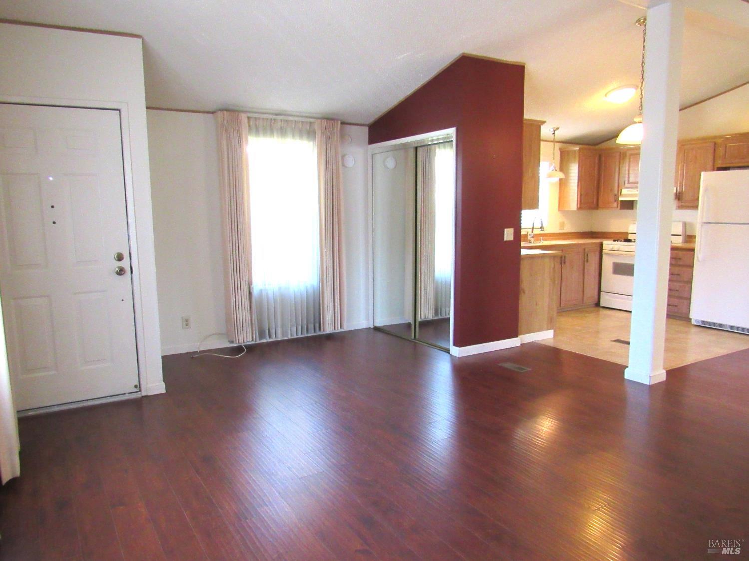 31 Ramon Street Sonoma, CA 95476 - Photo 11 of 24 a view of a kitchen with a fridge and wooden floor