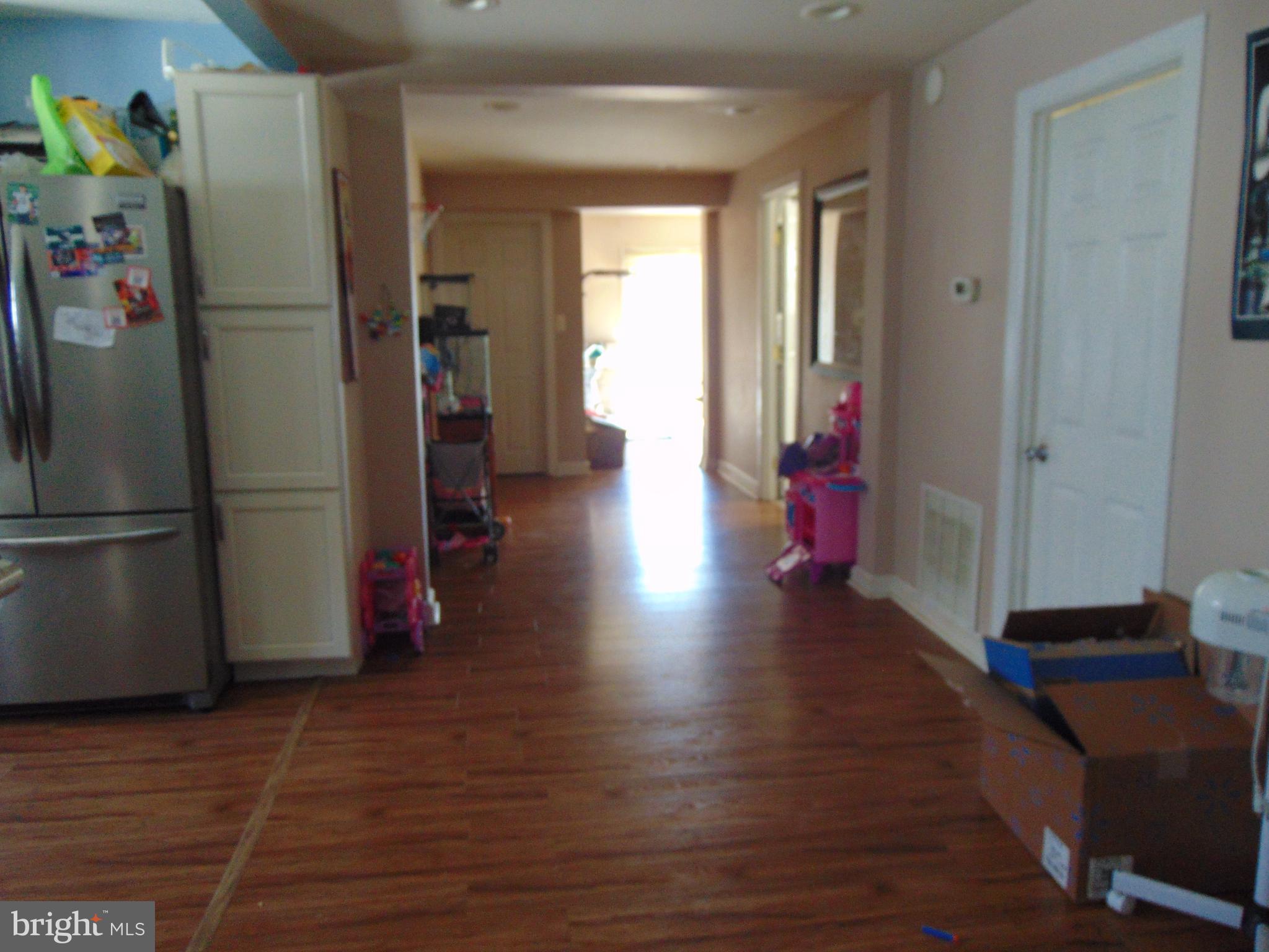 28 Franklin Avenue Clementon, NJ 08021 - Photo 6 of 26 a view of a hallway with wooden floor and closet