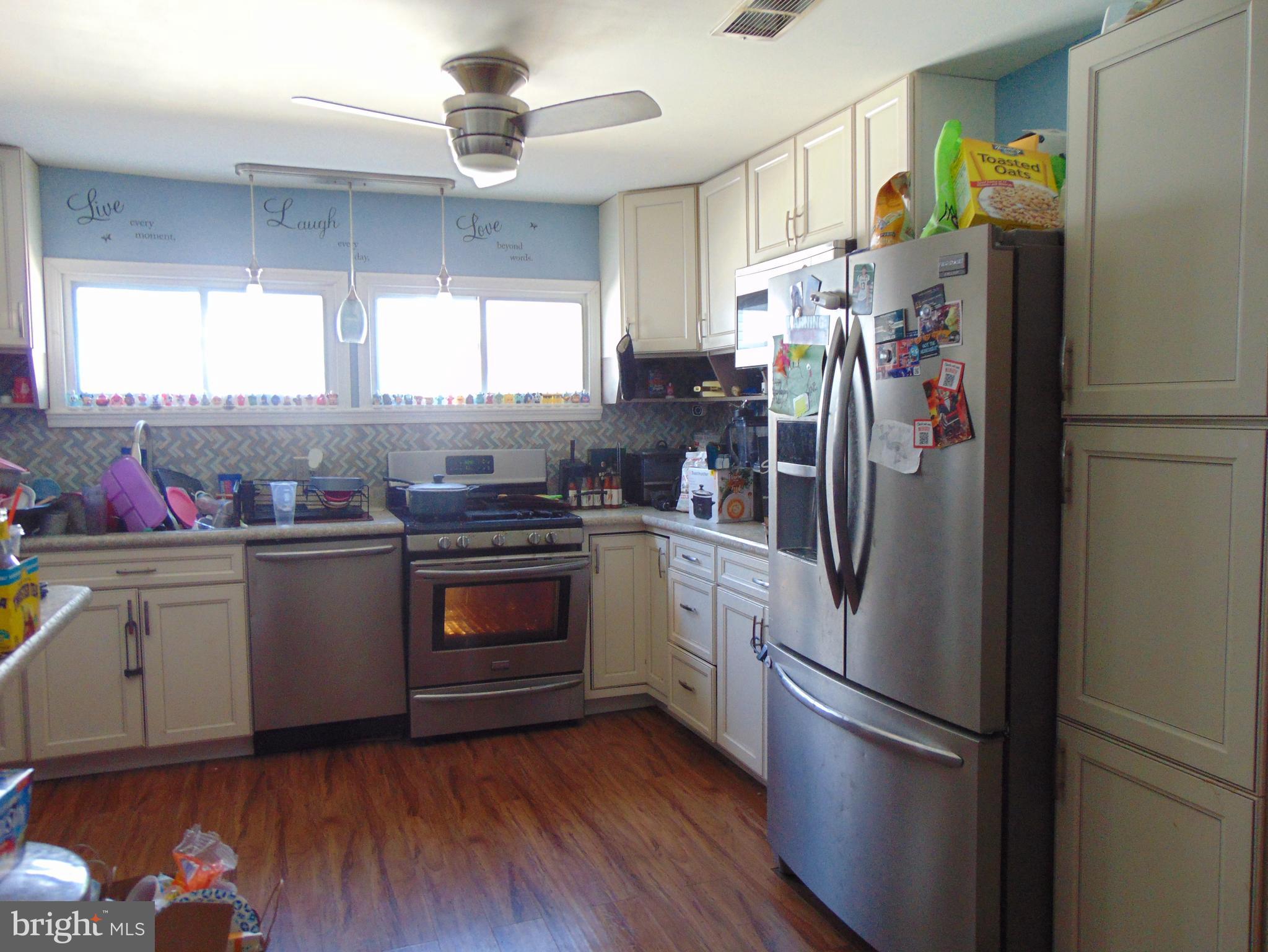 28 Franklin Avenue Clementon, NJ 08021 - Photo 8 of 26 a kitchen with granite countertop stainless steel appliances a refrigerator cabinets and a window