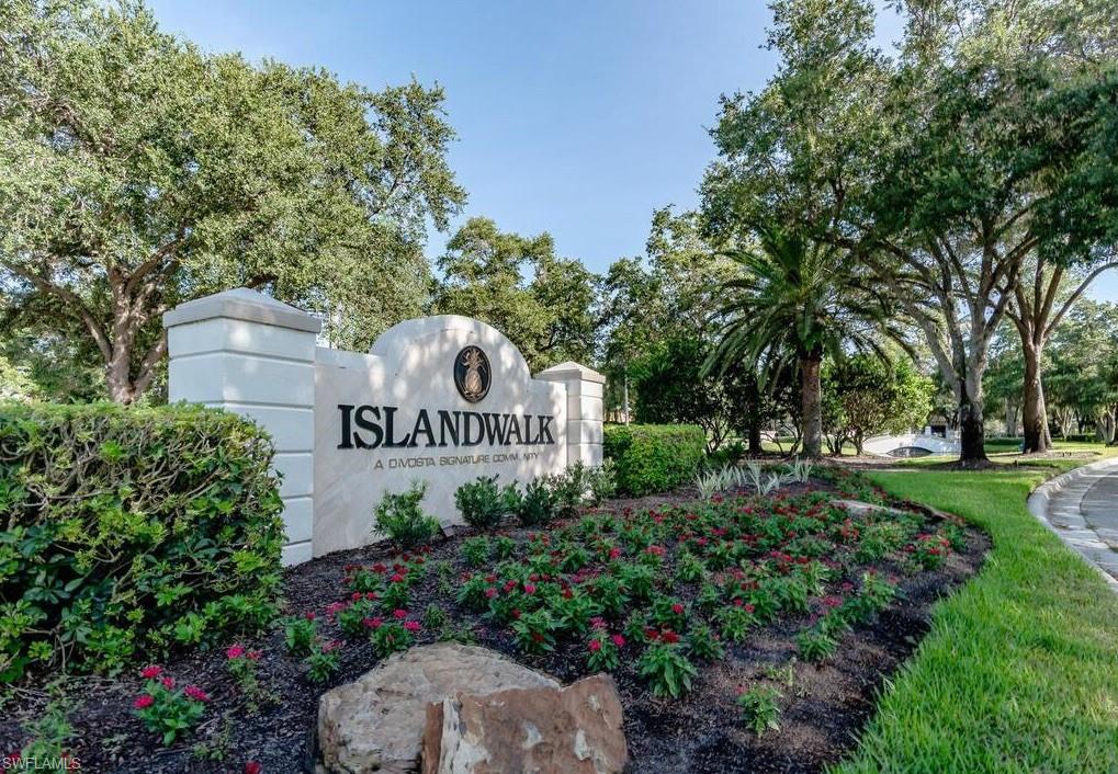 5477 Freeport Lane Naples, FL 34119 - Photo 30 of 36 a sign of golf club on a wall under a tree