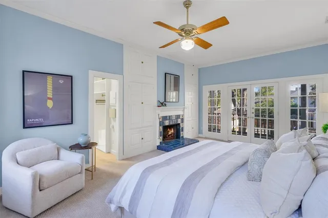 a bedroom with a large bed couch and a window