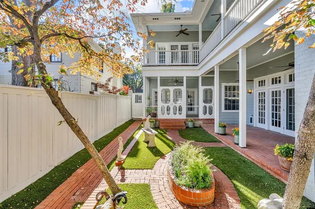 a view of an house with backyard and sitting area