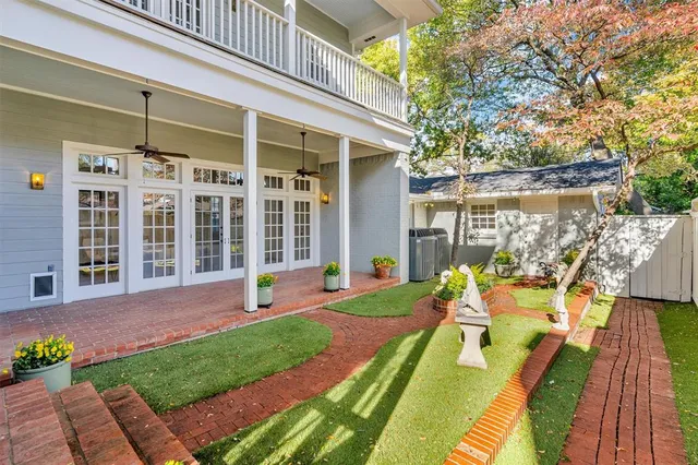 a view of a house with backyard porch and sitting area