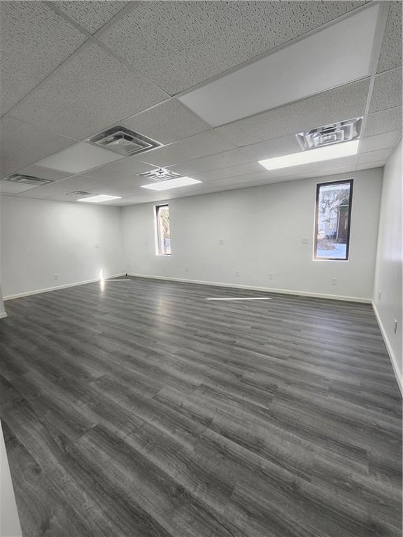 2921 Leechburg Road, Unit 2 Lower Burrell, PA 15068 - Photo 9 of 10 an empty room with wooden floor and windows