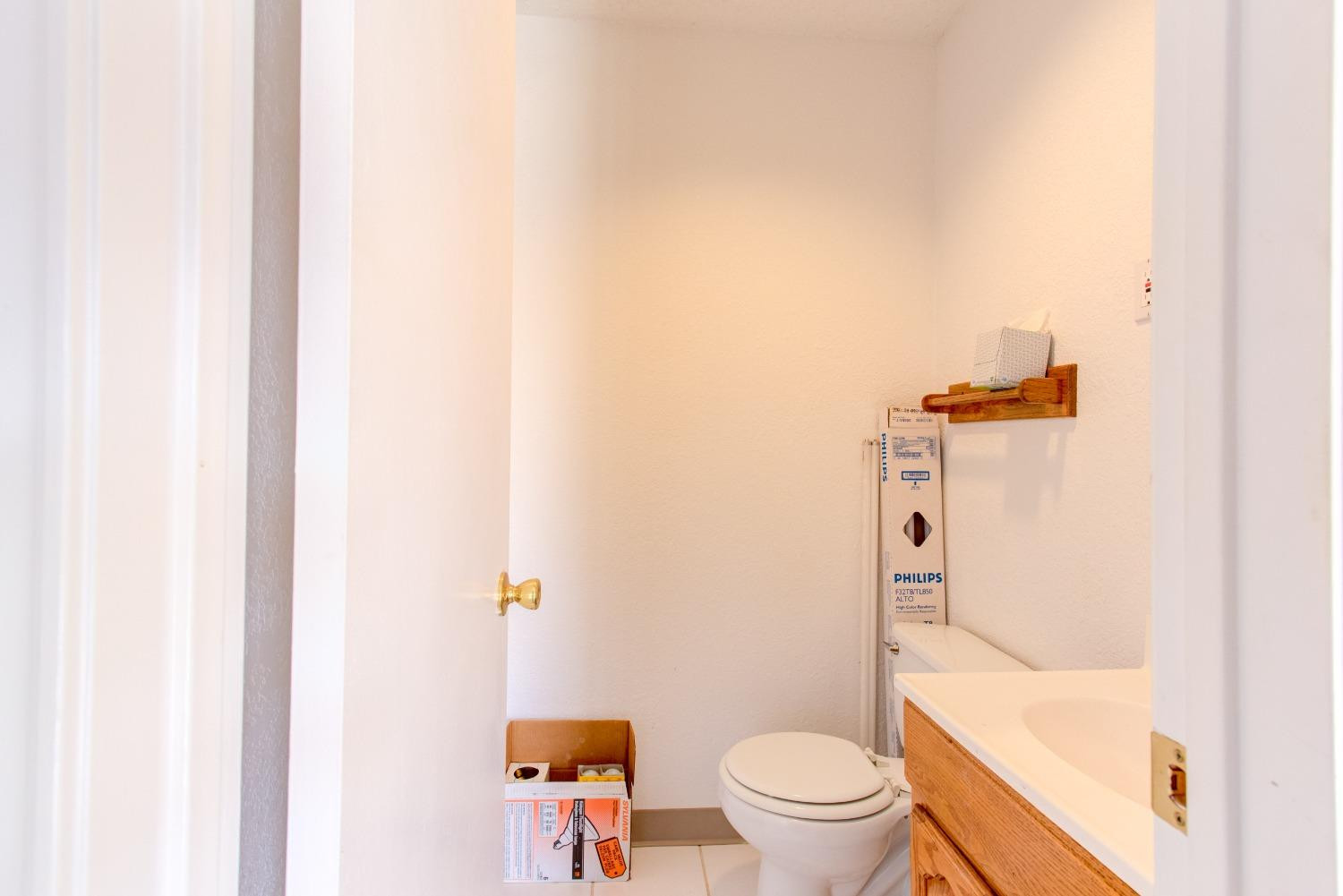 3410 40th Street Lubbock, TX 79413 - Photo 30 of 33 a white toilet sitting next to a bath tub
