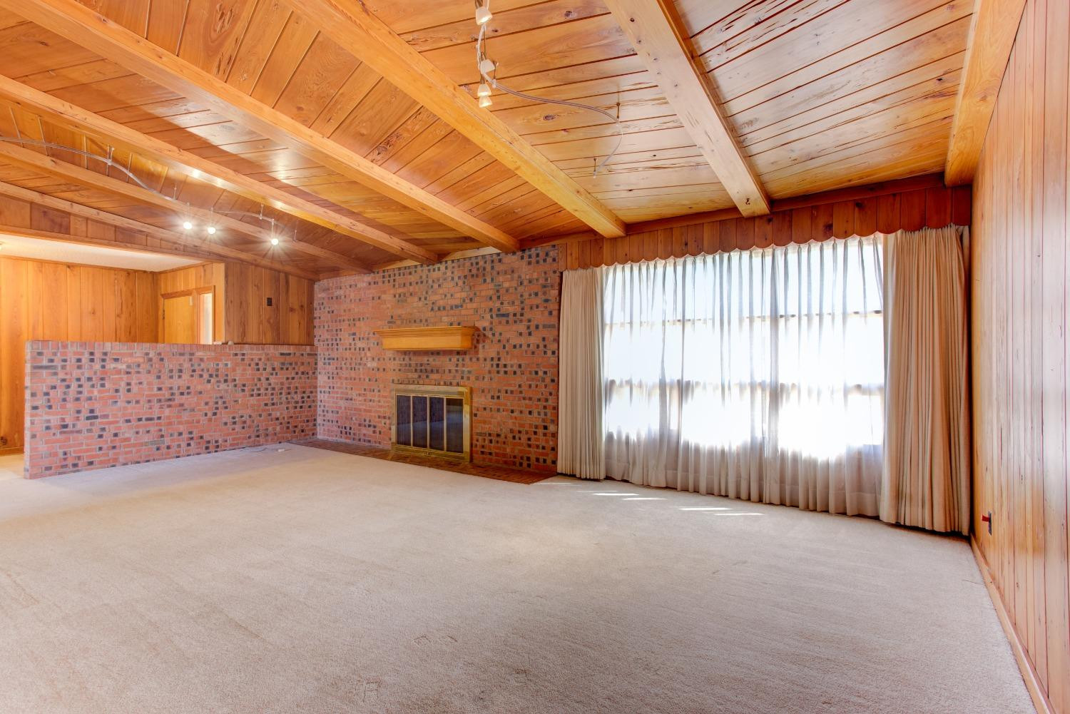 3410 40th Street Lubbock, TX 79413 - Photo 5 of 33 an empty room with windows
