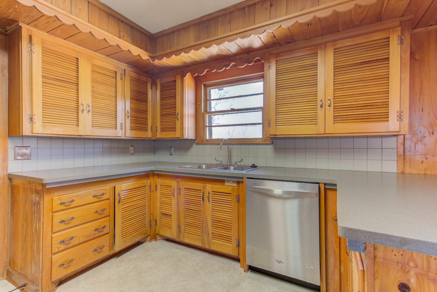 3410 40th Street Lubbock, TX 79413 - Photo 9 of 33 a kitchen that has a sink and cabinets