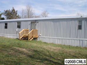 4220 Medlin Road Monroe, NC 28112 - Photo 1 of 7 a view of backyard with barbeque grill and plants