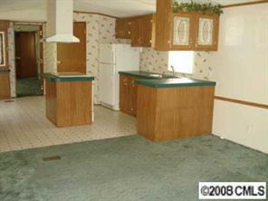 4220 Medlin Road Monroe, NC 28112 - Photo 2 of 7 a view of kitchen cabinets and wooden floor