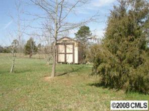 4220 Medlin Road Monroe, NC 28112 - Photo 6 of 7 a view of outdoor space and yard