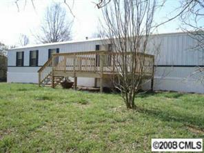 4220 Medlin Road Monroe, NC 28112 - Photo 7 of 7 a view of a house with a yard