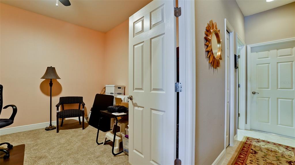 7401 Hamilton Road Bradenton, FL 34209 - Photo 17 of 35 a view of a hallway with workspace