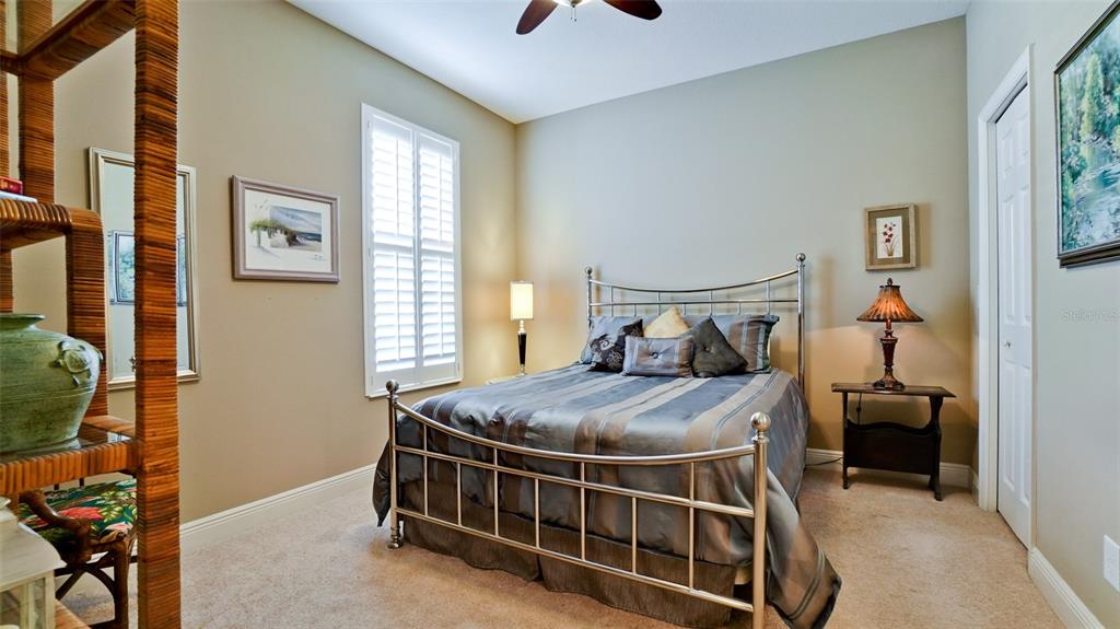 7401 Hamilton Road Bradenton, FL 34209 - Photo 18 of 35 a bed sitting in a bedroom next to a window