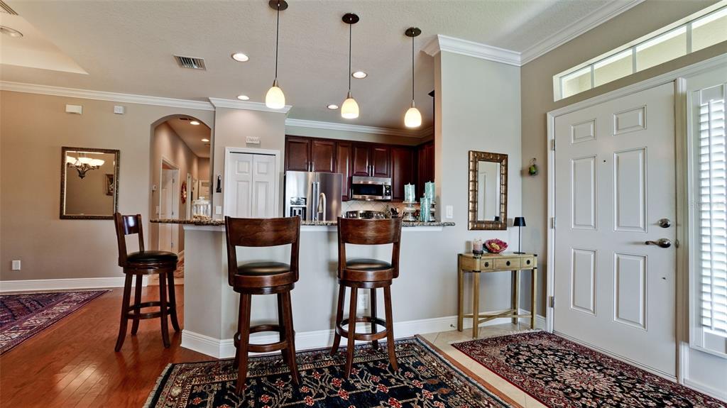 7401 Hamilton Road Bradenton, FL 34209 - Photo 5 of 35 a kitchen with stainless steel appliances granite countertop a refrigerator and a stove top oven