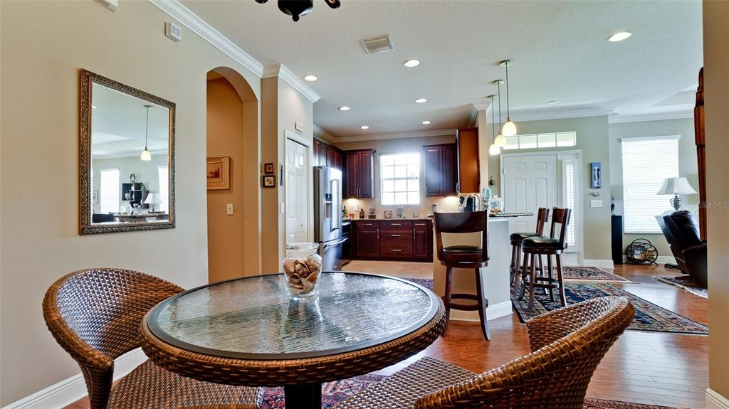 7401 Hamilton Road Bradenton, FL 34209 - Photo 8 of 35 a living room with furniture and a dining table
