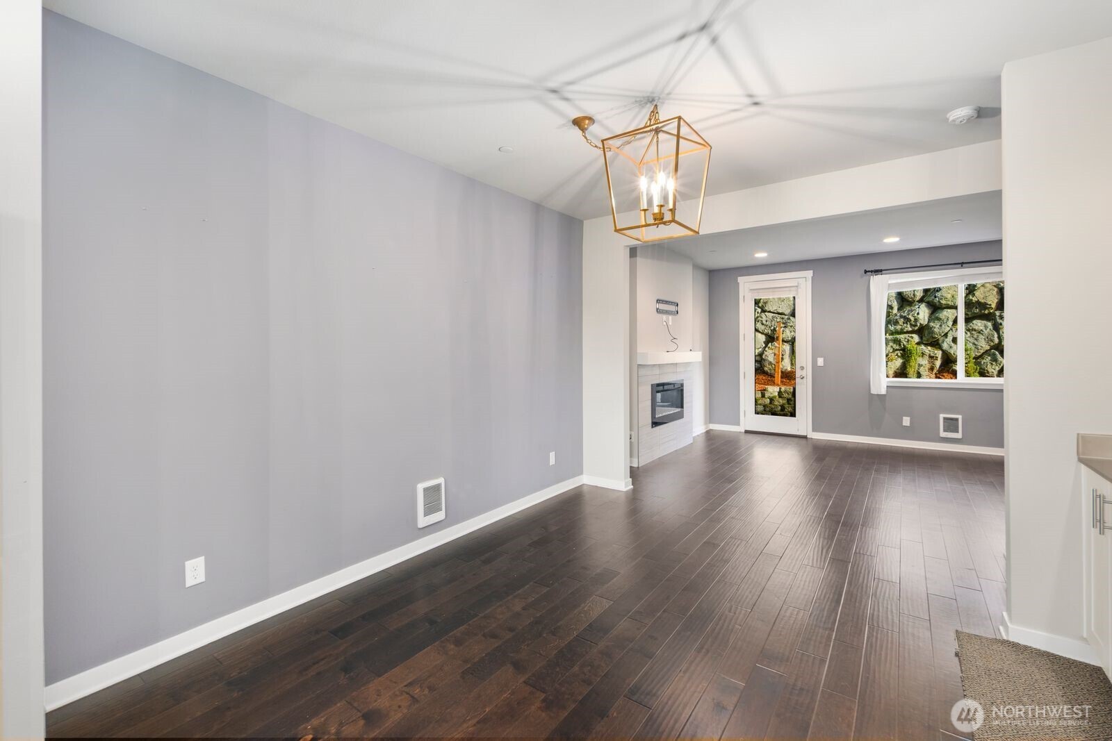 1325 Seattle Hill Road, Unit A2 Bothell, WA 98012 - Photo 13 of 35 an empty room with wooden floor and windows