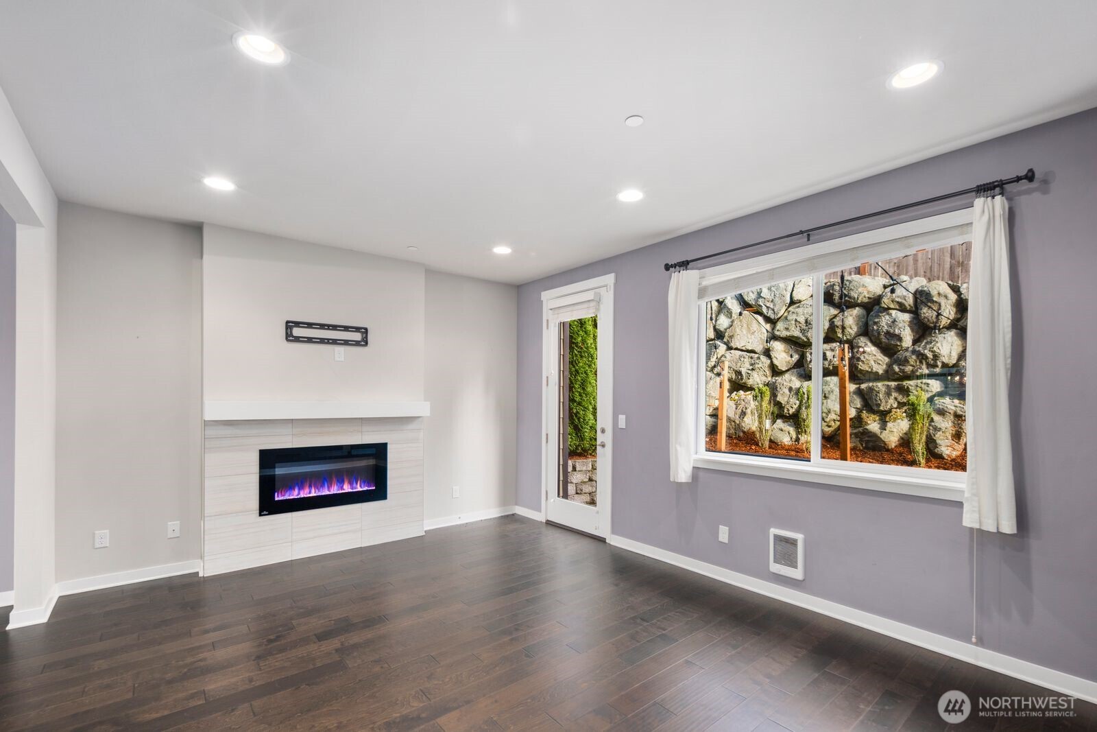 1325 Seattle Hill Road, Unit A2 Bothell, WA 98012 - Photo 17 of 35 an empty room with windows and fireplace