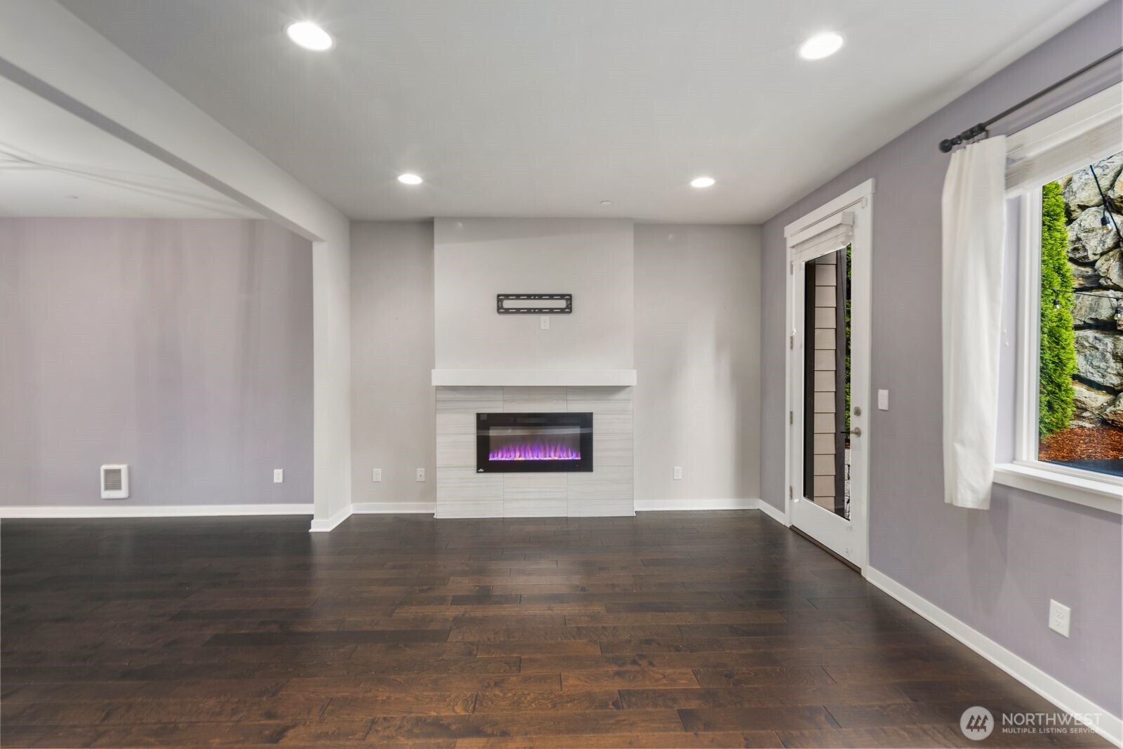 1325 Seattle Hill Road, Unit A2 Bothell, WA 98012 - Photo 19 of 35 a view of an empty room with wooden floor and a window