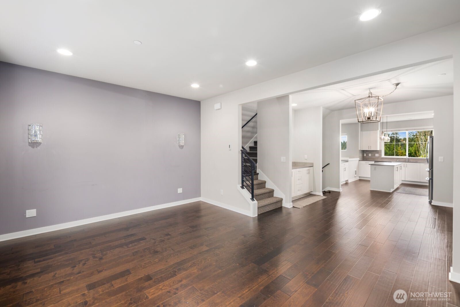1325 Seattle Hill Road, Unit A2 Bothell, WA 98012 - Photo 20 of 35 a view of a big room with wooden floor and a kitchen