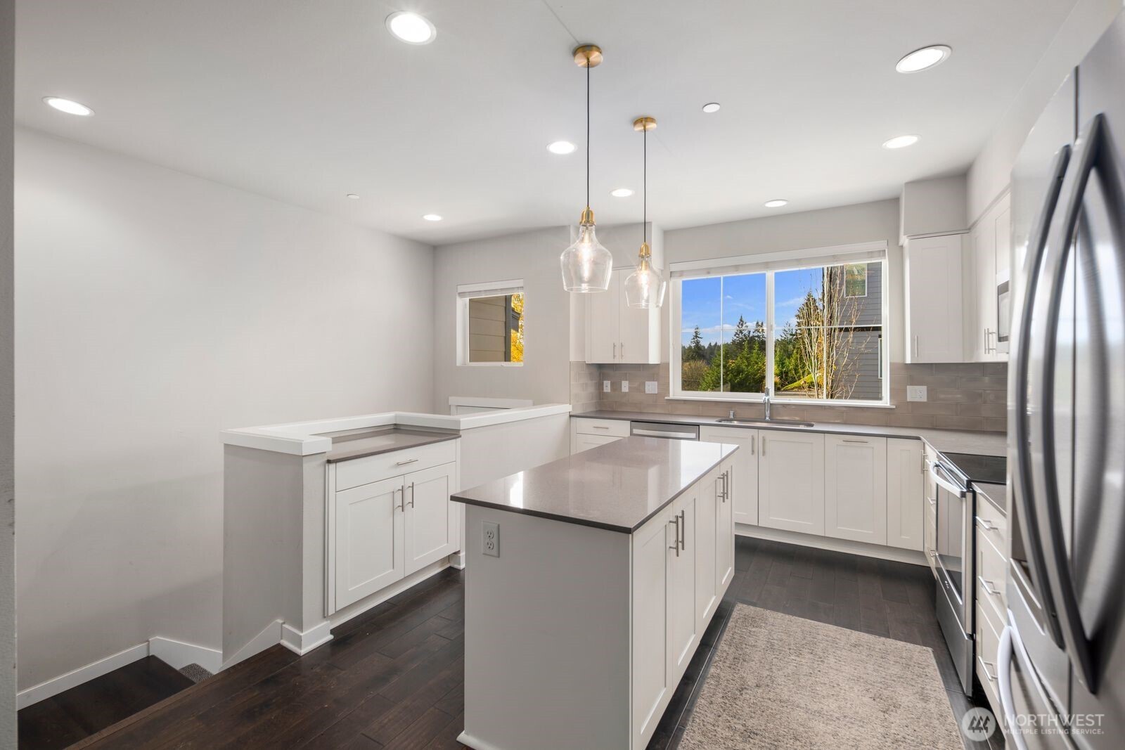 1325 Seattle Hill Road, Unit A2 Bothell, WA 98012 - Photo 7 of 35 a kitchen with a sink stove and refrigerator