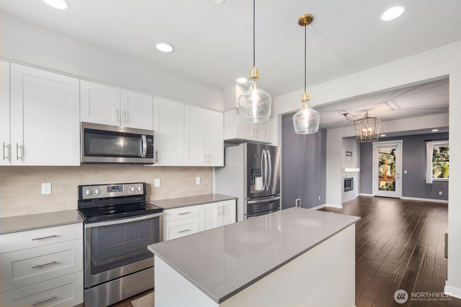 1325 Seattle Hill Road, Unit A2 Bothell, WA 98012 - Photo 8 of 35 a kitchen with a sink a microwave a stove and refrigerator