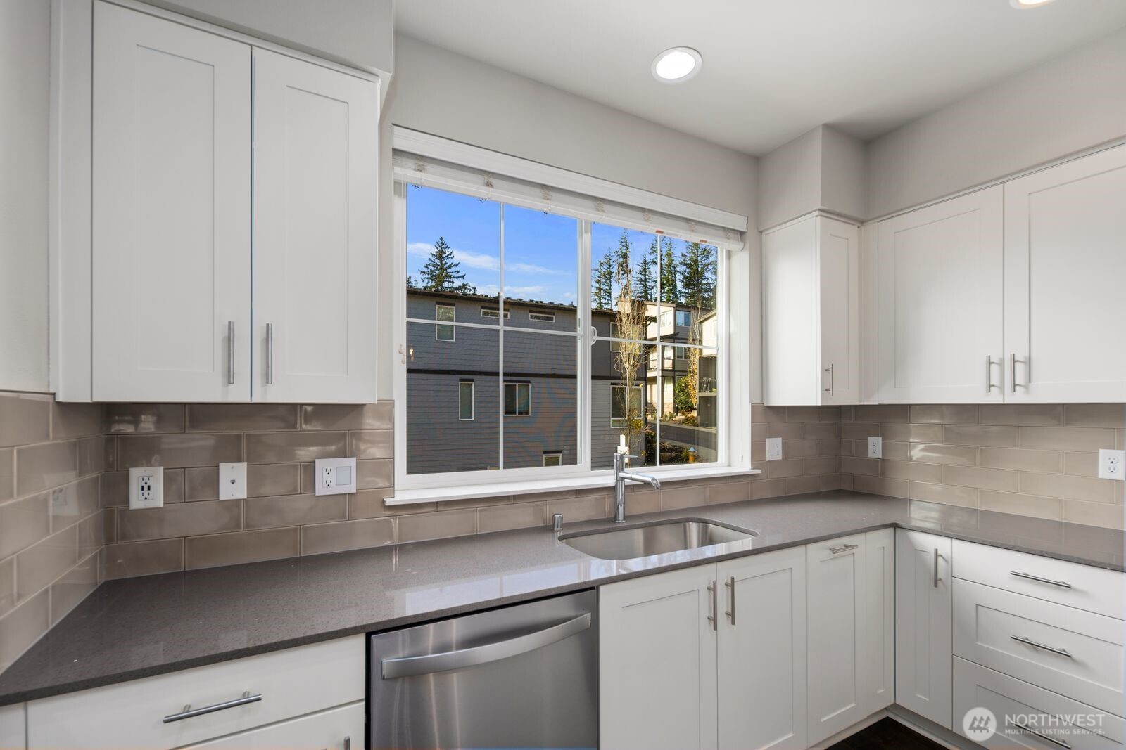 1325 Seattle Hill Road, Unit A2 Bothell, WA 98012 - Photo 9 of 35 a kitchen with stainless steel appliances granite countertop a sink a stove and a white cabinets