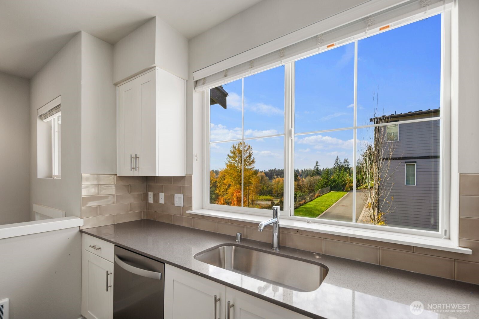 1325 Seattle Hill Road, Unit A2 Bothell, WA 98012 - Photo 10 of 35 a kitchen with a sink cabinets and window