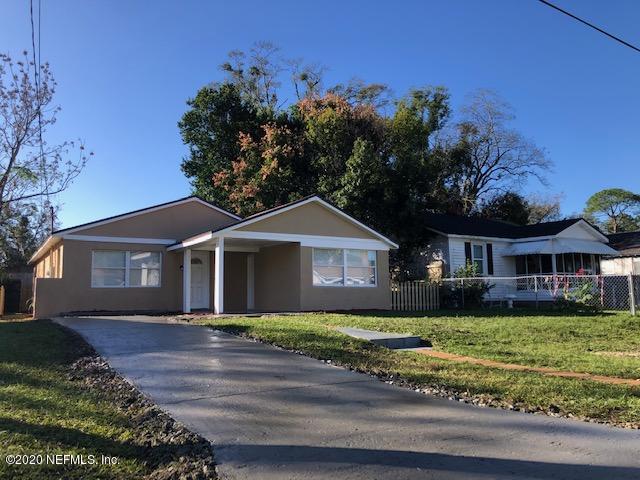 5122 Birkenhead Road Jacksonville, FL 32210 - Photo 1 of 31 a front view of a house with a garden
